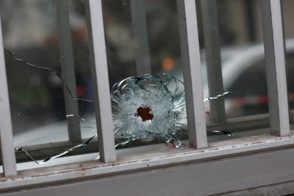 Bullet hole at the Charlie Hebdo offices in Paris