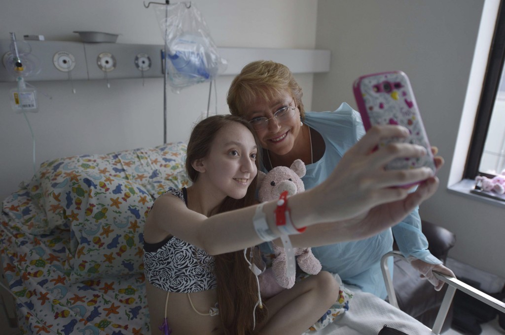 Chile's President Michelle Bachelet poses for a selfie with Valentina Maureira, a 14-year old girl who suffers from cystic fibrosis.