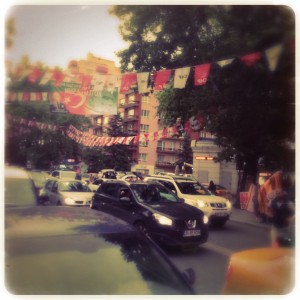 Flags declaring party allegiances flutter in the streets of Ankara.