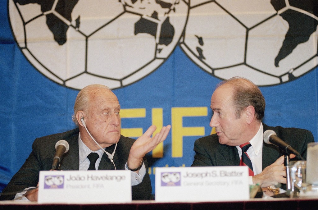 In this 1994 photograph, João Havelange, left, then-president of FIFA, and Sepp Blatter, then-general secretary, confer during a press conference in New York. Havelange ran soccer’s governing body for 24 years, before Blatter took over the leadership.