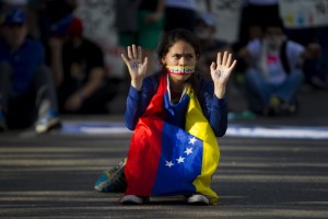 A female protester calls for peace in Venezuela.