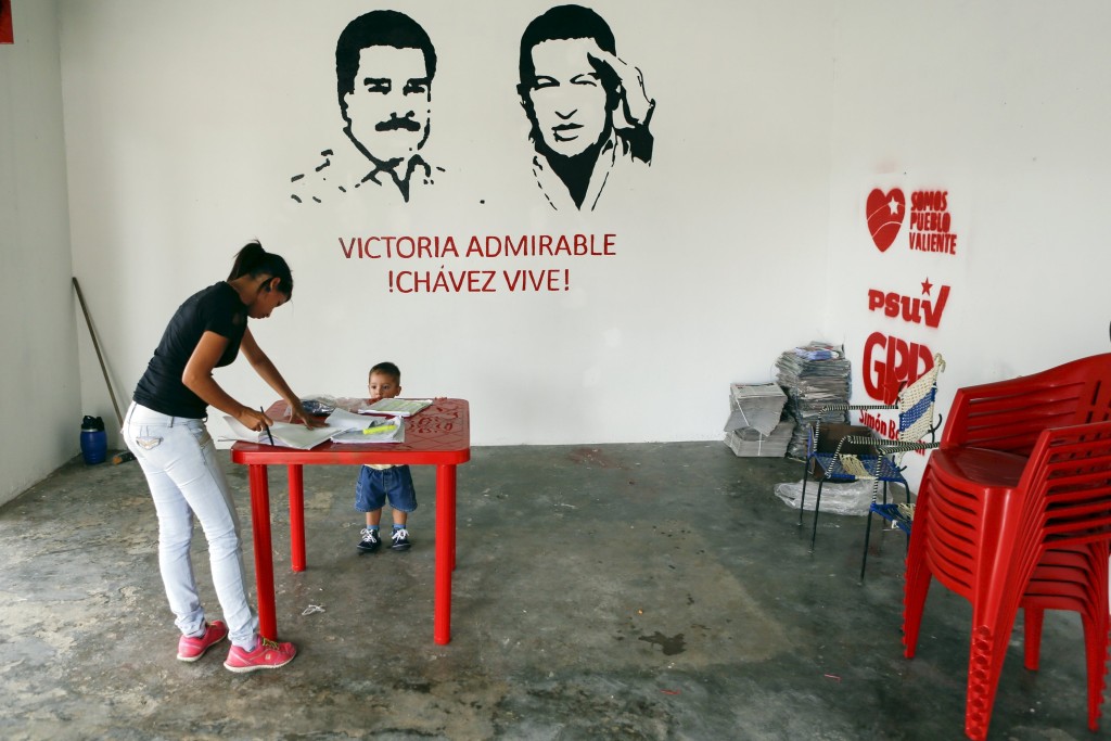 A woman arranges documents at a campaign office of Venezuela’s United Socialist Party (PSUV) in Santa Rita.